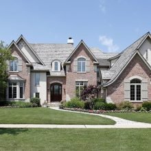 bigstock-Brick-Home-With-Cedar-Roof-7364434